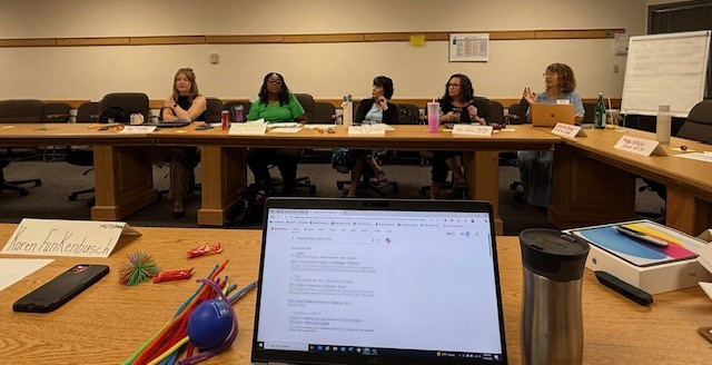 5 people discussing strategies