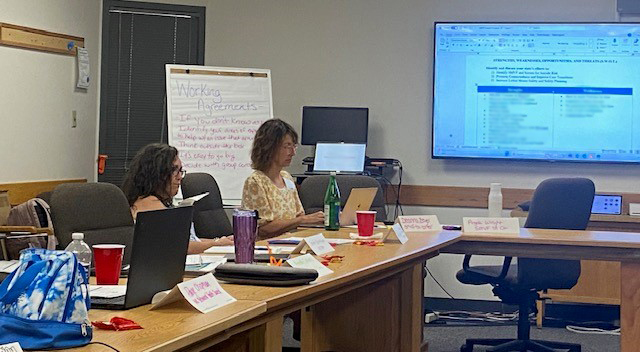 2 people discussing suicide prevention needs